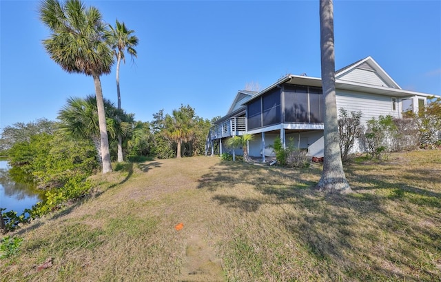 view of yard with a sunroom