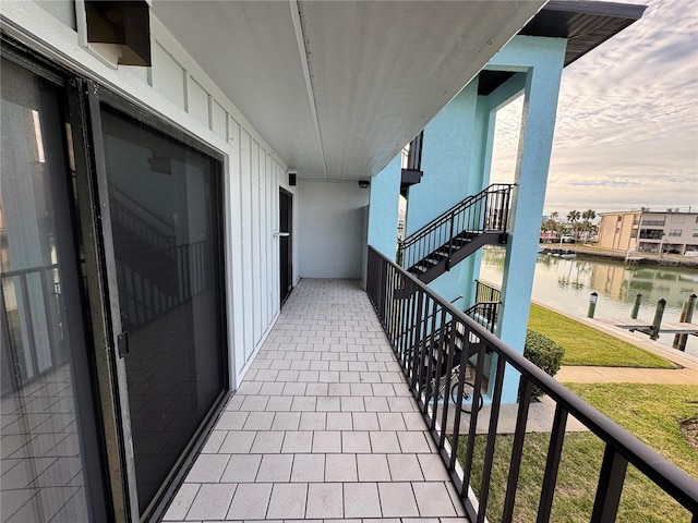 balcony featuring a water view