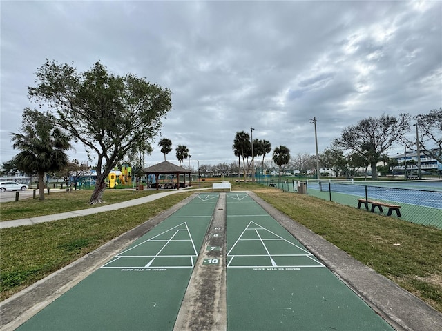 surrounding community featuring a playground, a gazebo, a yard, and tennis court