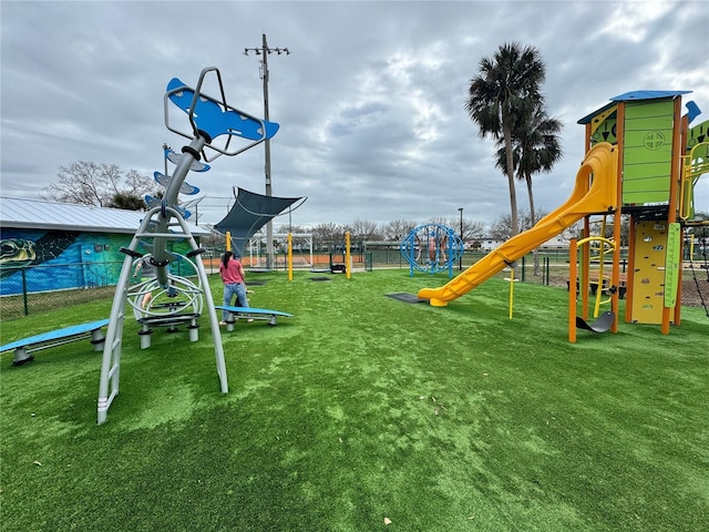 view of jungle gym with a lawn