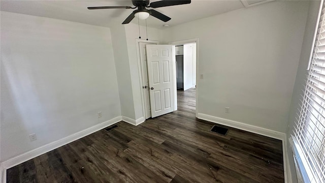 unfurnished bedroom with dark hardwood / wood-style flooring and ceiling fan