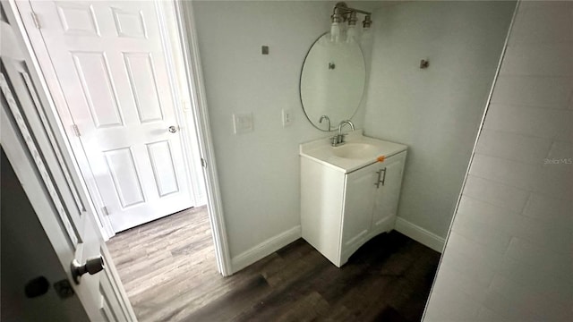 bathroom with hardwood / wood-style flooring and vanity