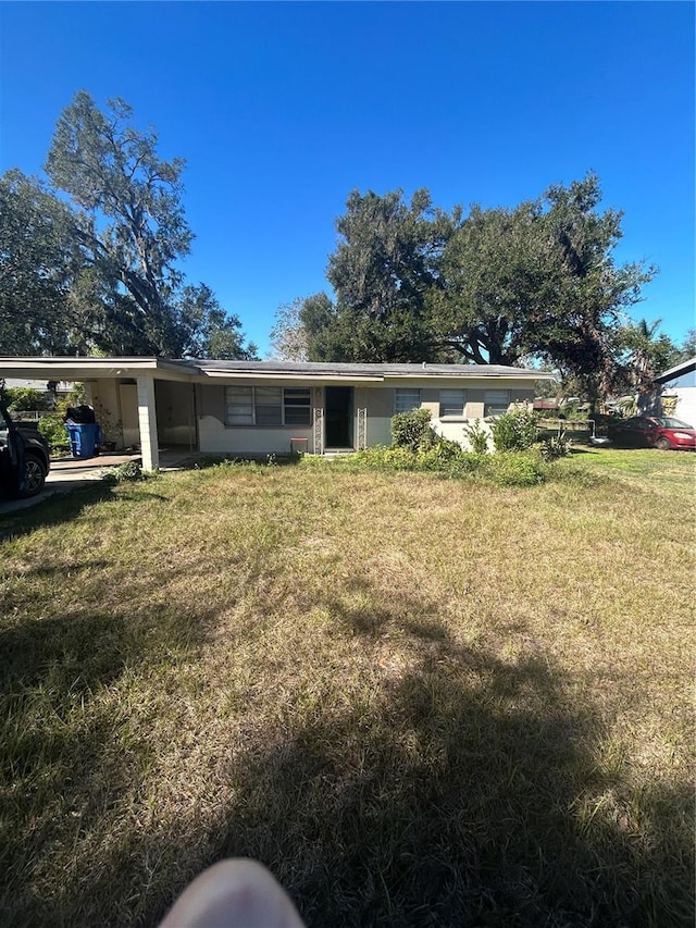 exterior space with a carport