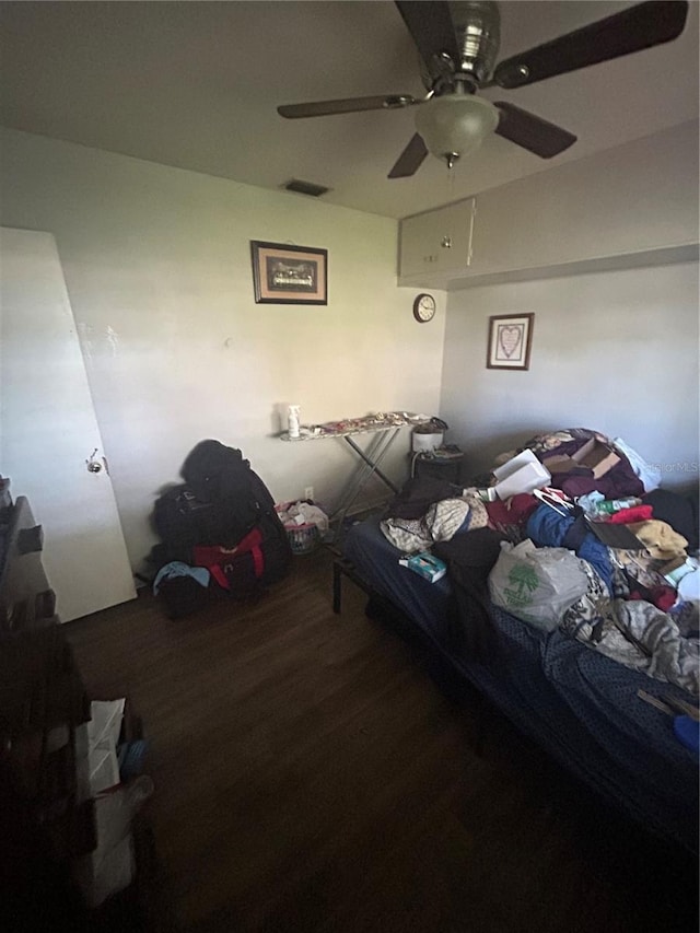 bedroom with hardwood / wood-style flooring and ceiling fan