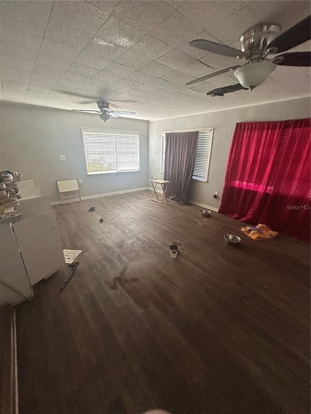 spare room featuring wood-type flooring and ceiling fan