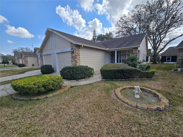 view of front of home featuring a garage and a front lawn