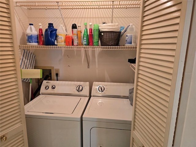 clothes washing area featuring washer and dryer