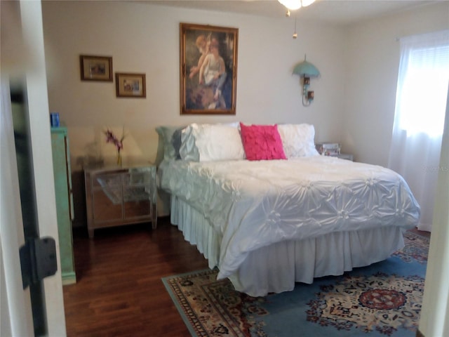 bedroom featuring dark hardwood / wood-style flooring