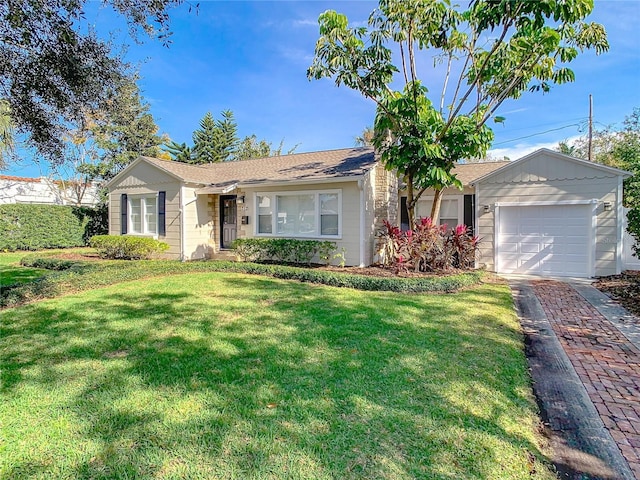 single story home with a garage and a front lawn