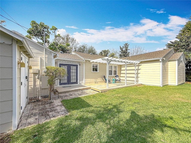 rear view of house with a yard, a pergola, and a patio