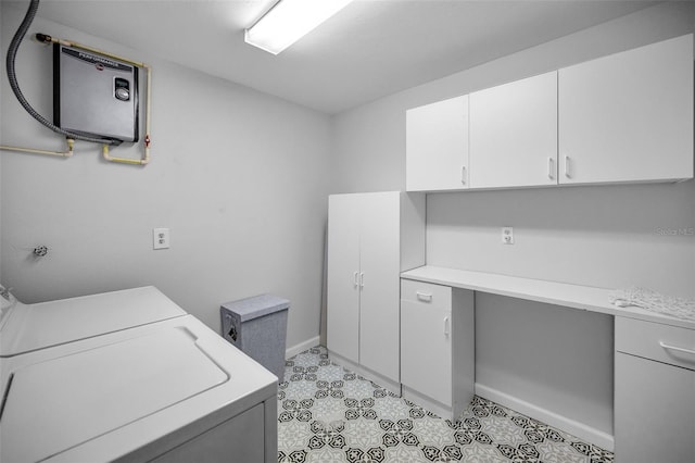 laundry area with cabinets and washer / clothes dryer