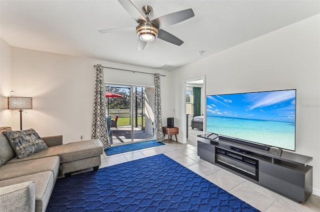 living room with ceiling fan and light tile patterned floors