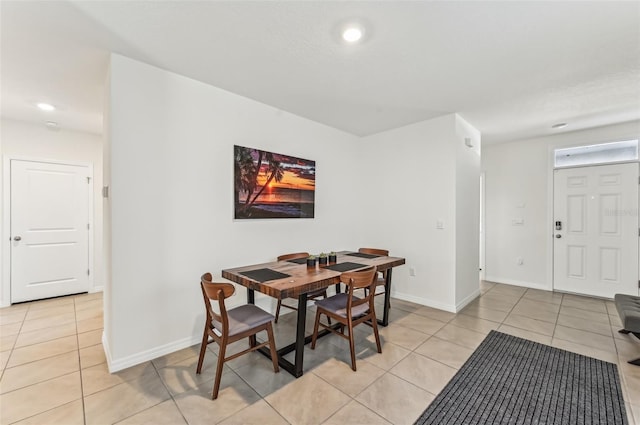 dining area with light tile patterned flooring