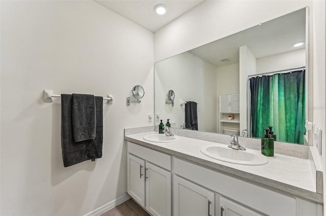 bathroom with vanity and tile patterned flooring