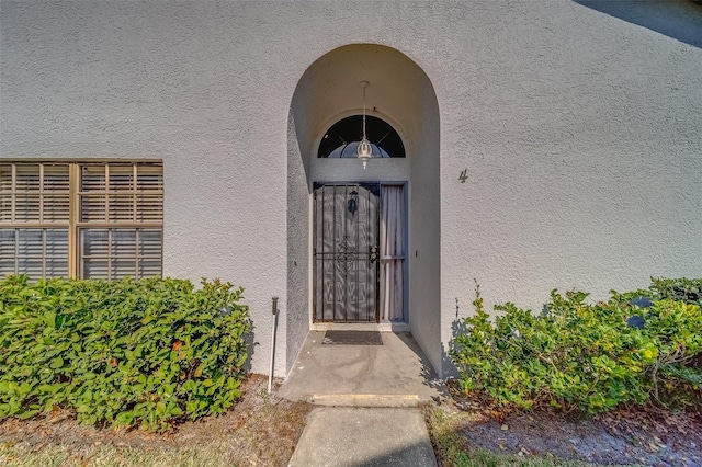 doorway to property with stucco siding