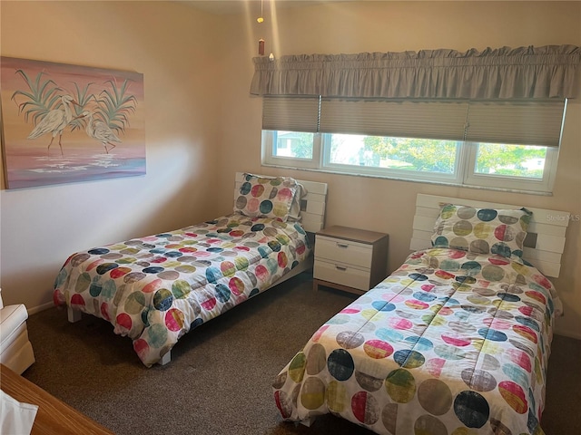 carpeted bedroom featuring multiple windows