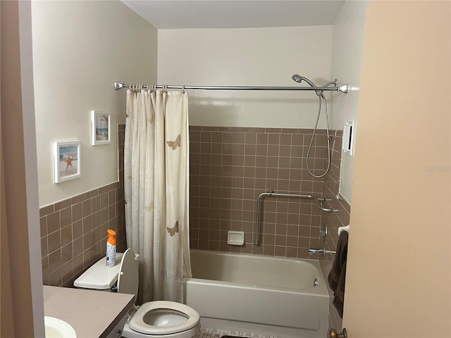 full bathroom with tile walls, vanity, shower / bath combination with curtain, and toilet