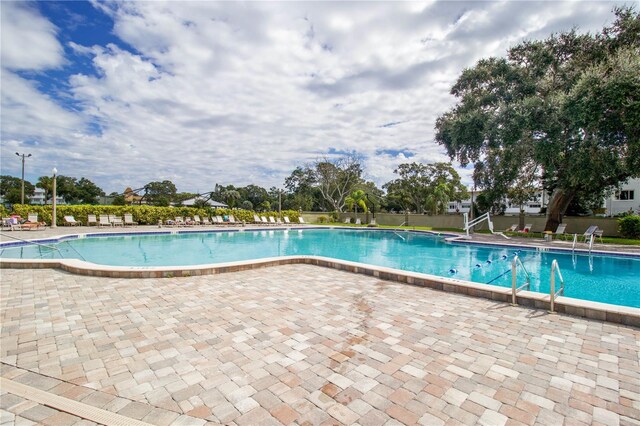 view of pool featuring a patio area