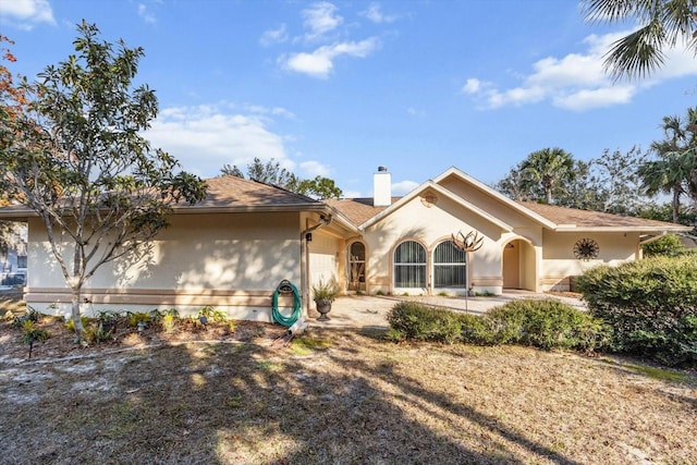 ranch-style home with a patio