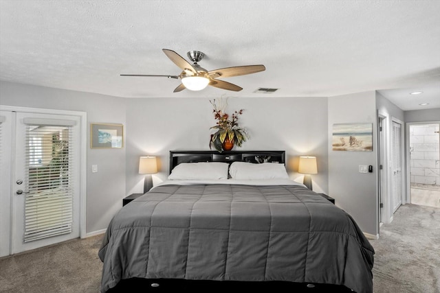 carpeted bedroom featuring access to exterior, ensuite bathroom, a textured ceiling, and ceiling fan