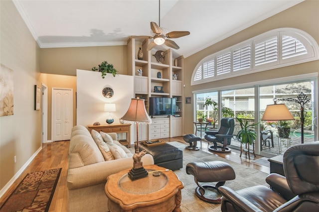 living room featuring hardwood / wood-style floors, crown molding, high vaulted ceiling, and ceiling fan