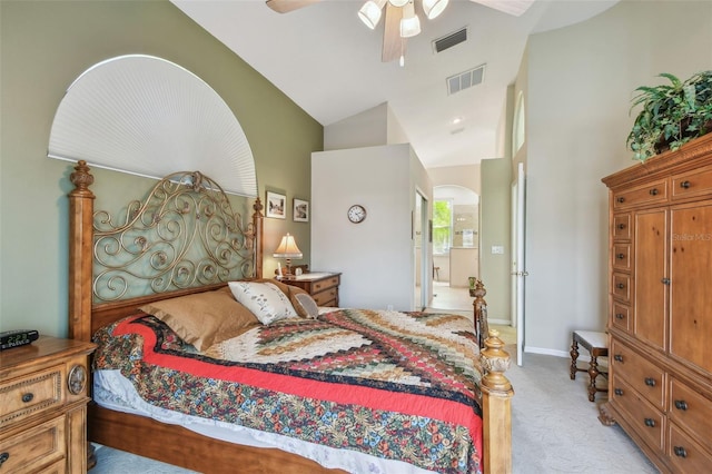 bedroom with high vaulted ceiling, light colored carpet, and ceiling fan