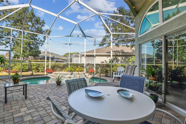 view of patio featuring glass enclosure