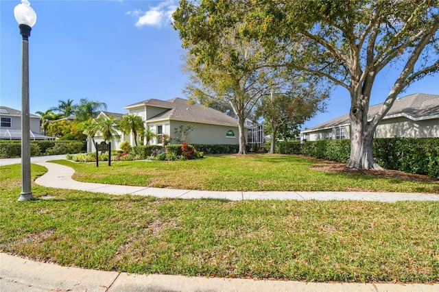 view of home's exterior with a lawn