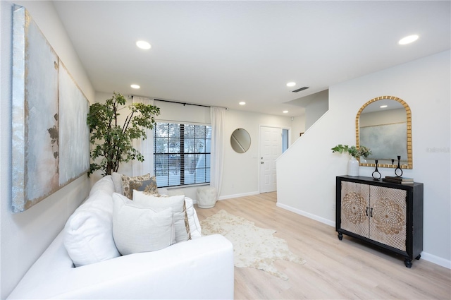 living room with light hardwood / wood-style flooring