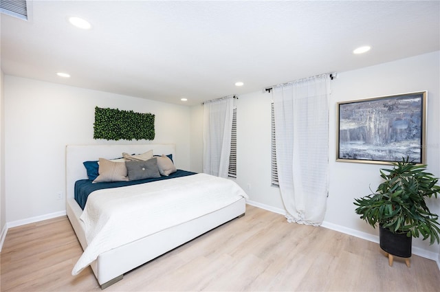 bedroom with light hardwood / wood-style flooring