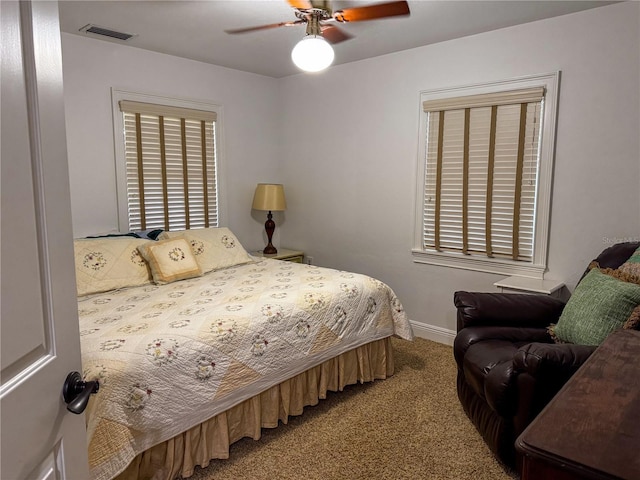 bedroom with ceiling fan and carpet flooring