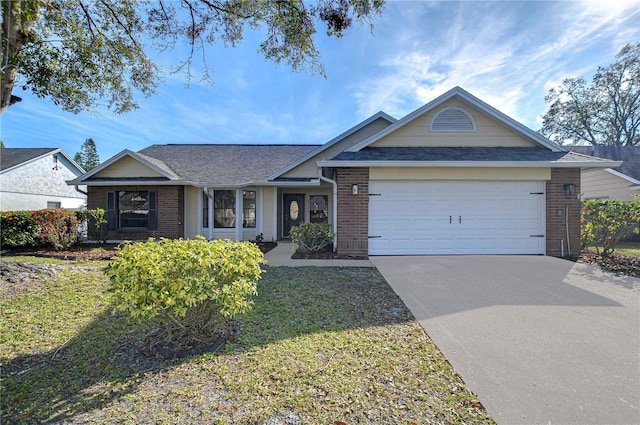 ranch-style home with a garage and a front lawn