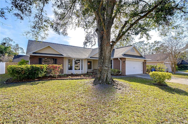 ranch-style house with a garage and a front yard