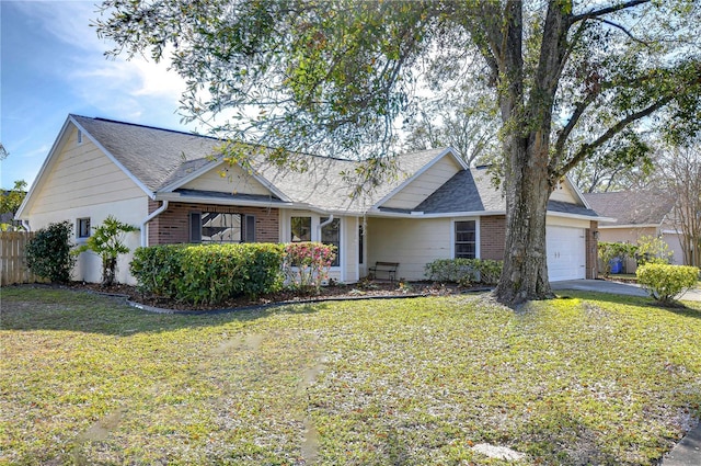 ranch-style house featuring a garage and a front lawn