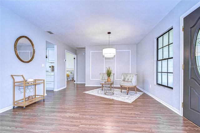 living area with hardwood / wood-style flooring