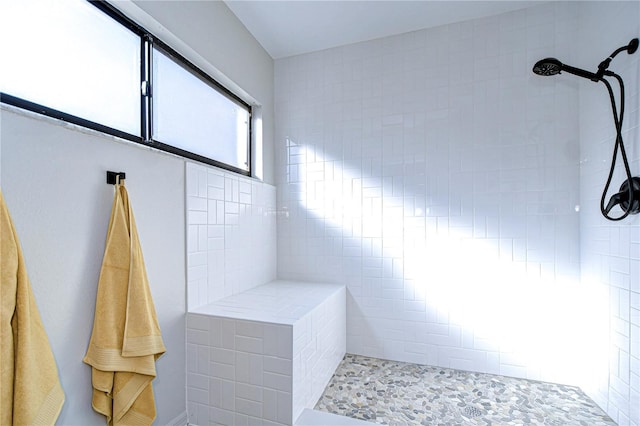 bathroom with tiled shower