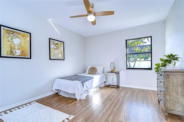 bedroom featuring wood-type flooring and ceiling fan