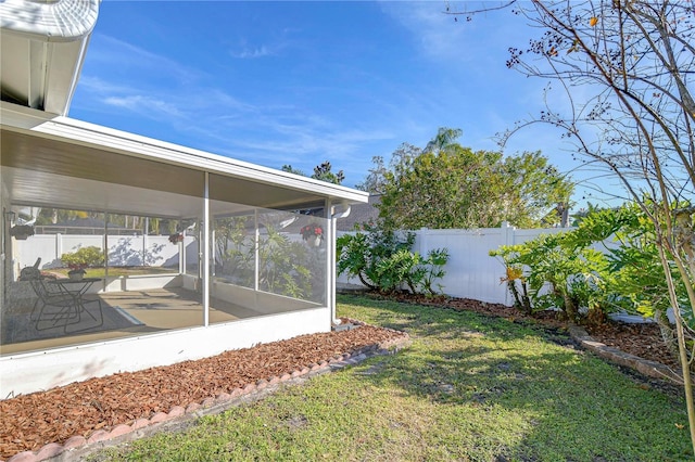 view of yard featuring a sunroom