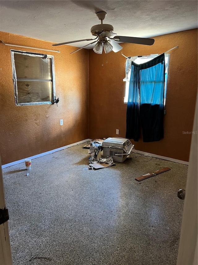 unfurnished room with ceiling fan