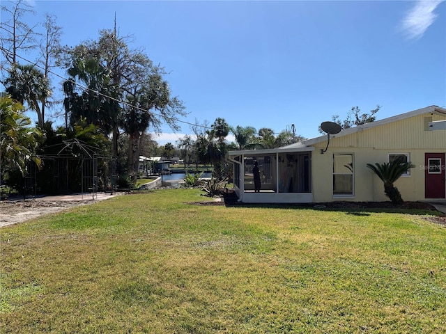 view of yard featuring a sunroom