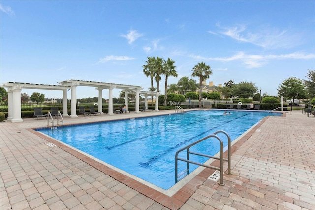 view of pool with a patio and a pergola