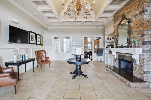 living room with coffered ceiling, a stone fireplace, light tile patterned floors, a towering ceiling, and beam ceiling