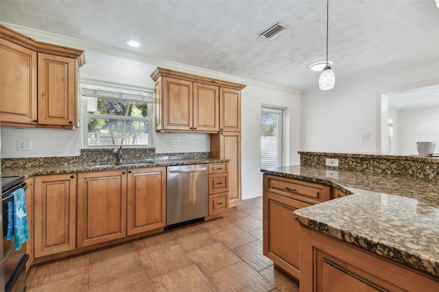 kitchen with pendant lighting, sink, stainless steel appliances, and dark stone countertops