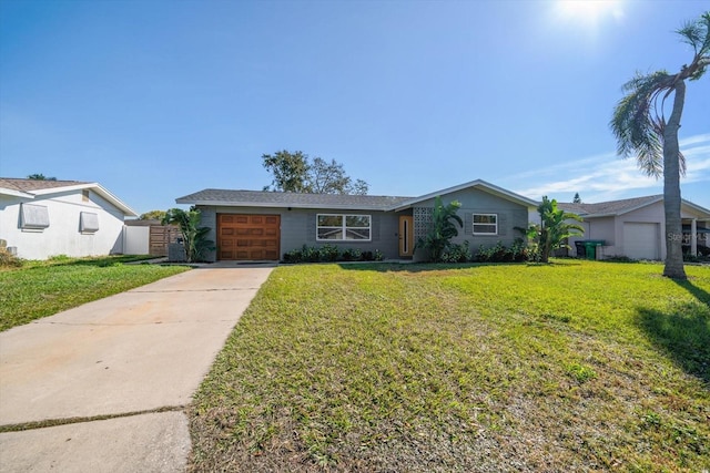 9893 111th St, Seminole, FL 33772 - ranch-style home featuring a garage and a front lawn