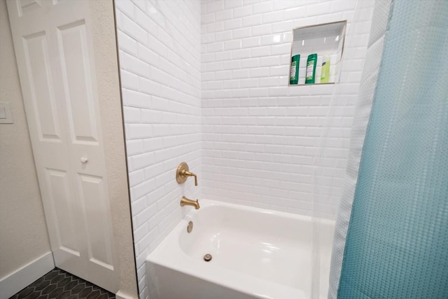 bathroom featuring shower / tub combo with curtain and tile patterned floors