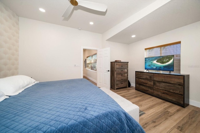 bedroom with ceiling fan and light hardwood / wood-style floors