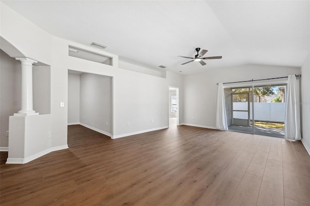 unfurnished living room featuring dark wood-type flooring, ceiling fan, vaulted ceiling, and ornate columns