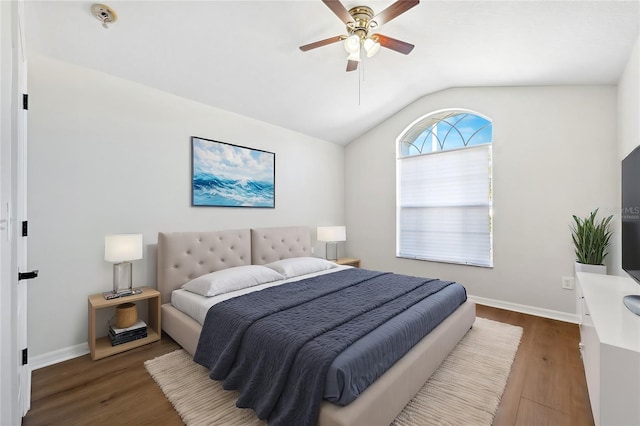 bedroom featuring dark wood-type flooring, ceiling fan, and lofted ceiling