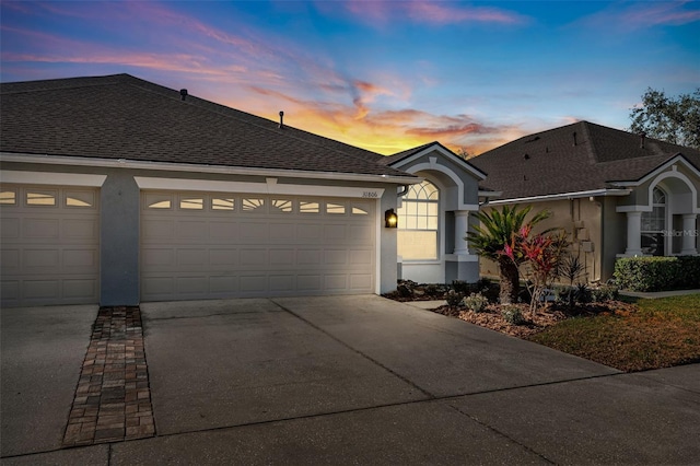 single story home with a garage