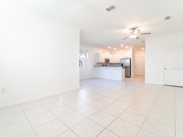 unfurnished living room with ceiling fan, ornamental molding, and light tile patterned floors